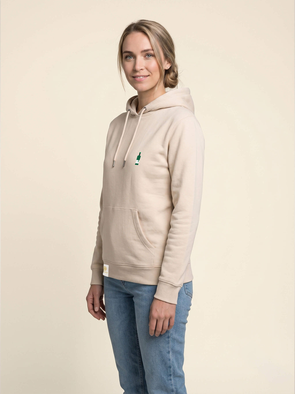 Side view of woman wearing ivory Signature Hoodie with Whisky Bottle on left chest to match your favourite flavour profile.