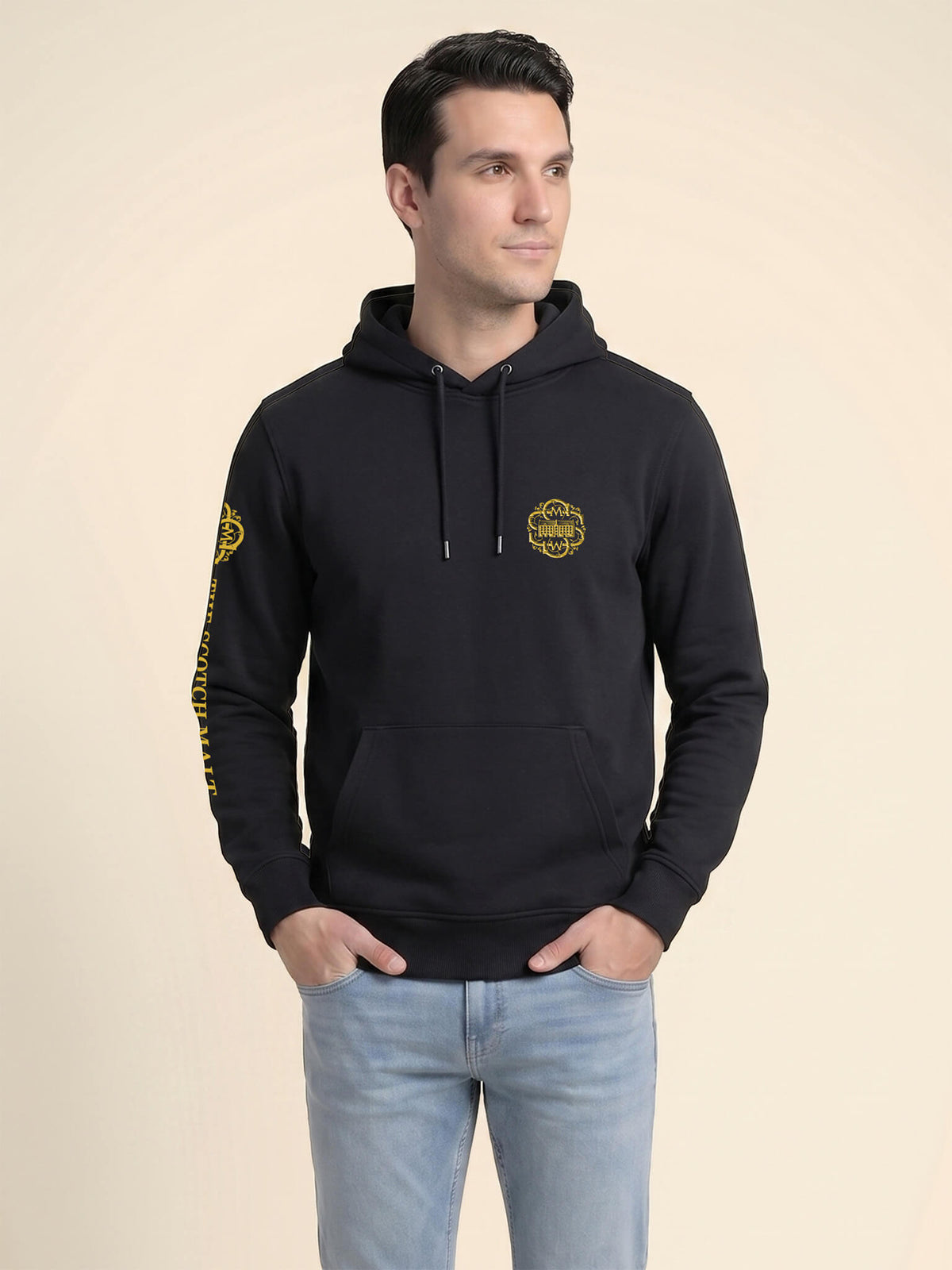 Man wearing a black Scottish Malt Whisky Society hoodie with gold logo on the left chest.
