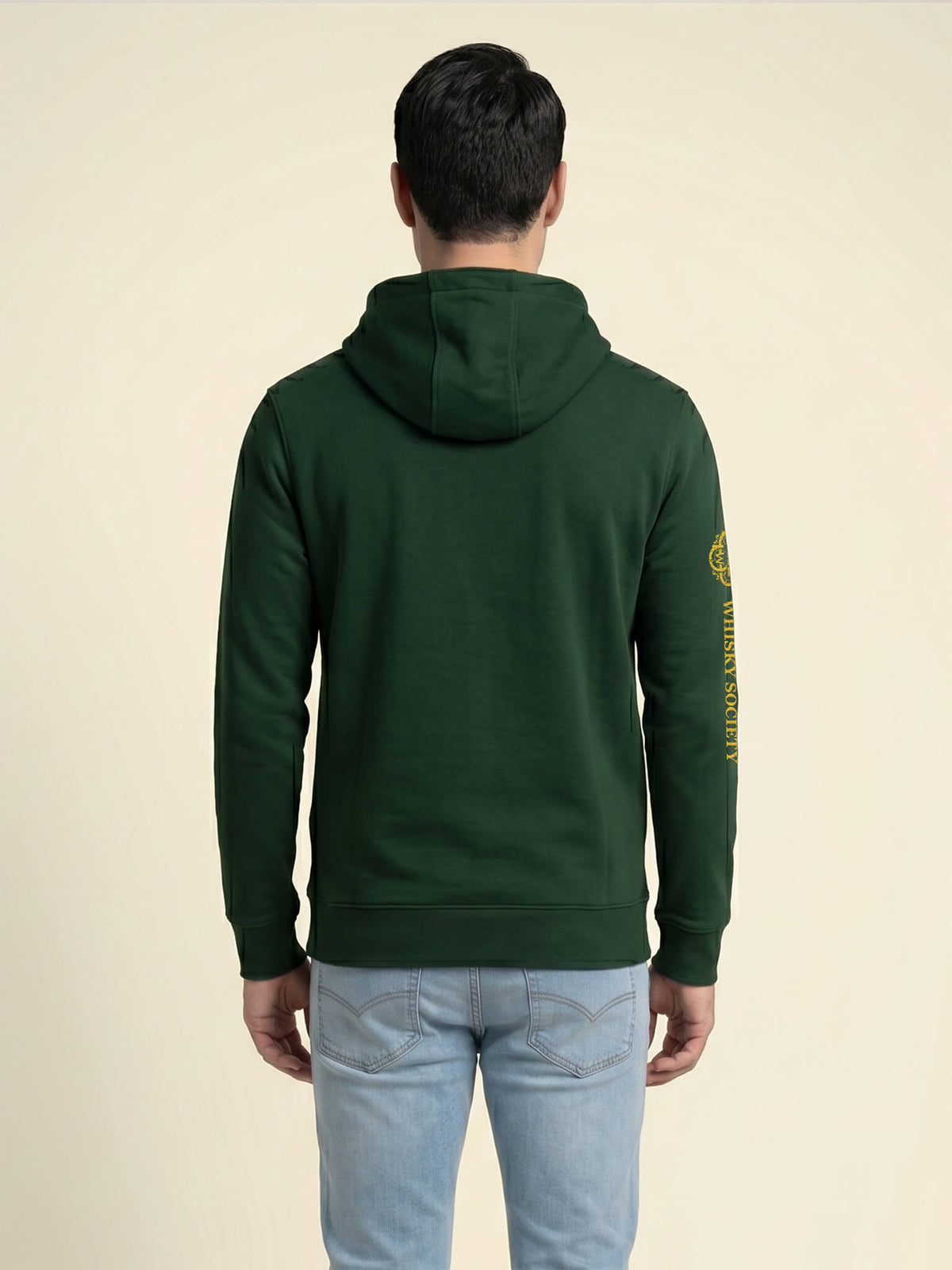 Back view of a man wearing a forest green Scottish Malt Whisky Society hoodiet.