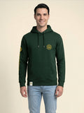 Man wearing a forest green Scottish Malt Whisky Society hoodie with gold logo on the left chest.