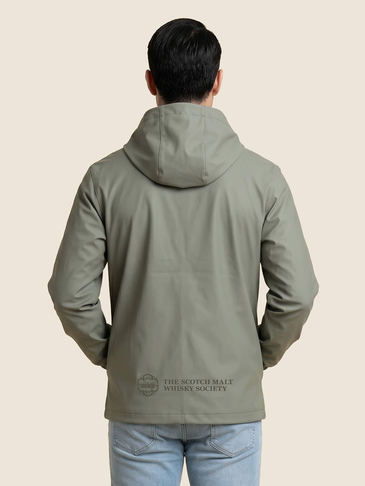 Back view of man wearing a khaki Scottish Malt Whisky Society windbreaker jacket with tone on tone logo above the hem.