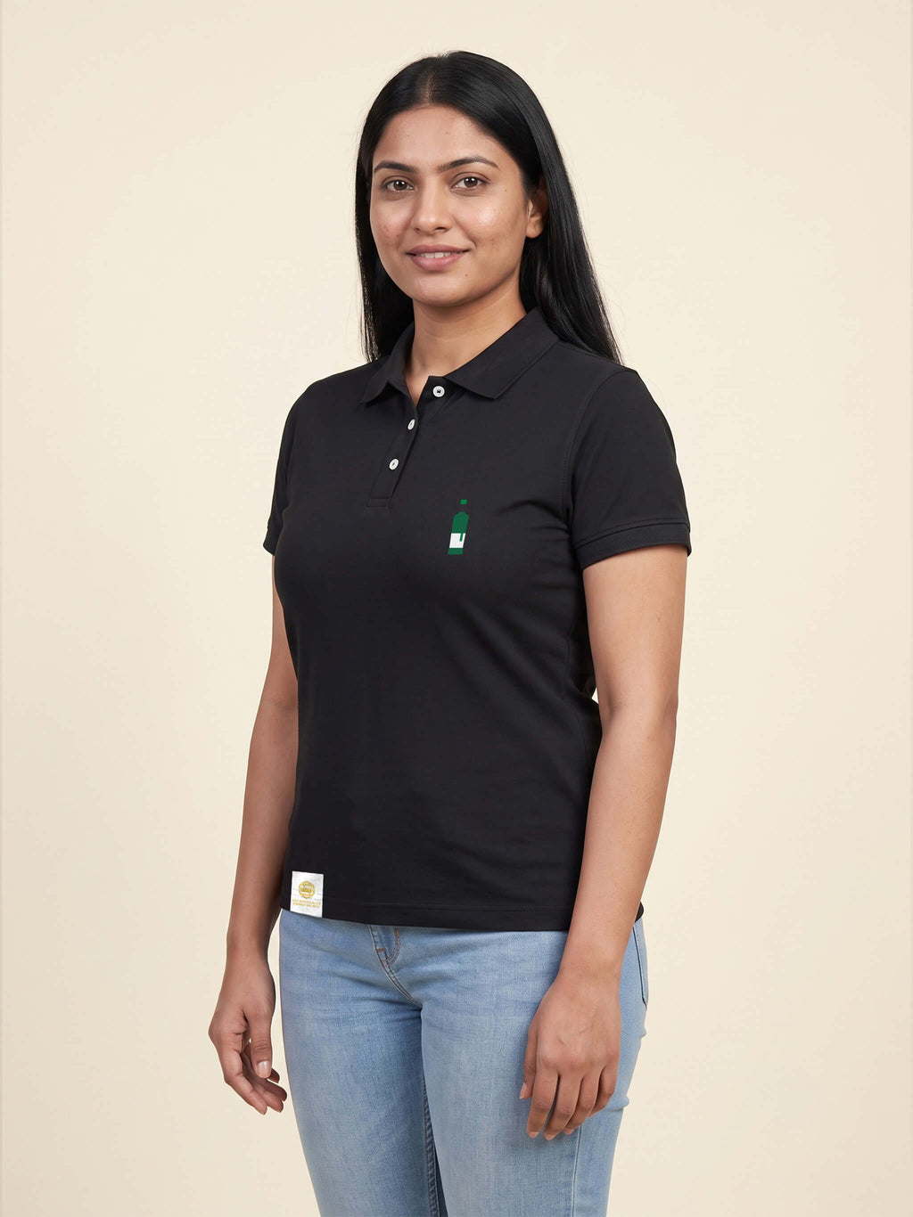 Woman wearing black Signature Fitted Polo with bottle printed on left chest matched to your favourite flavour profile
