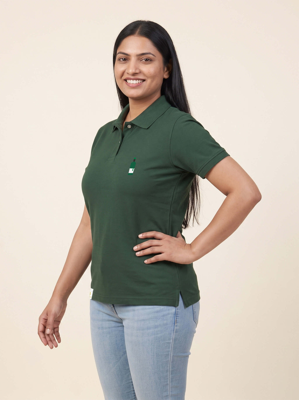 Woman wearing forest green Signature Fitted Polo with bottle printed on left chest matched to your favourite flavour profile