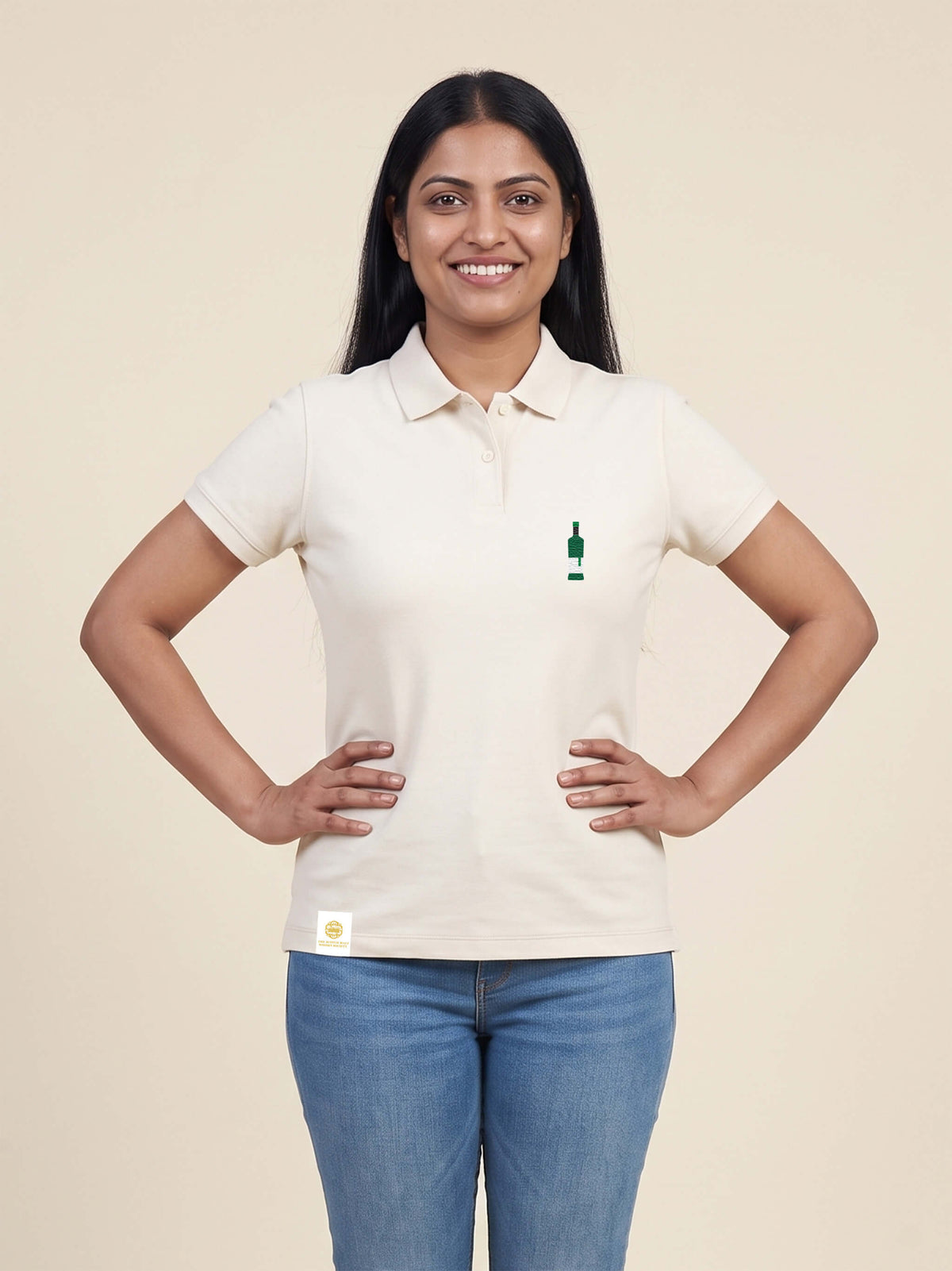 Woman wearing ivory Signature Fitted Polo with bottle printed on left chest matched to your favourite flavour profile