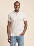 Man wearing ivory Signature Polo Shirt with whisky bottle matched to your favourite flavour profile on left chest.