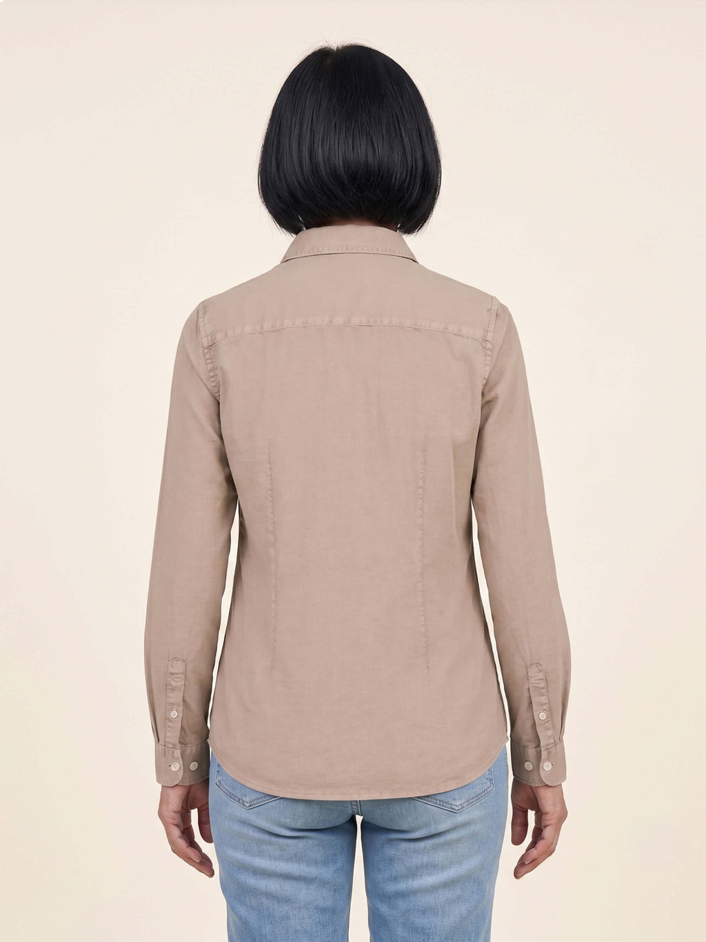Back view of woman wearing a washed linen Scottish Malt Whisky Society organic shirt.