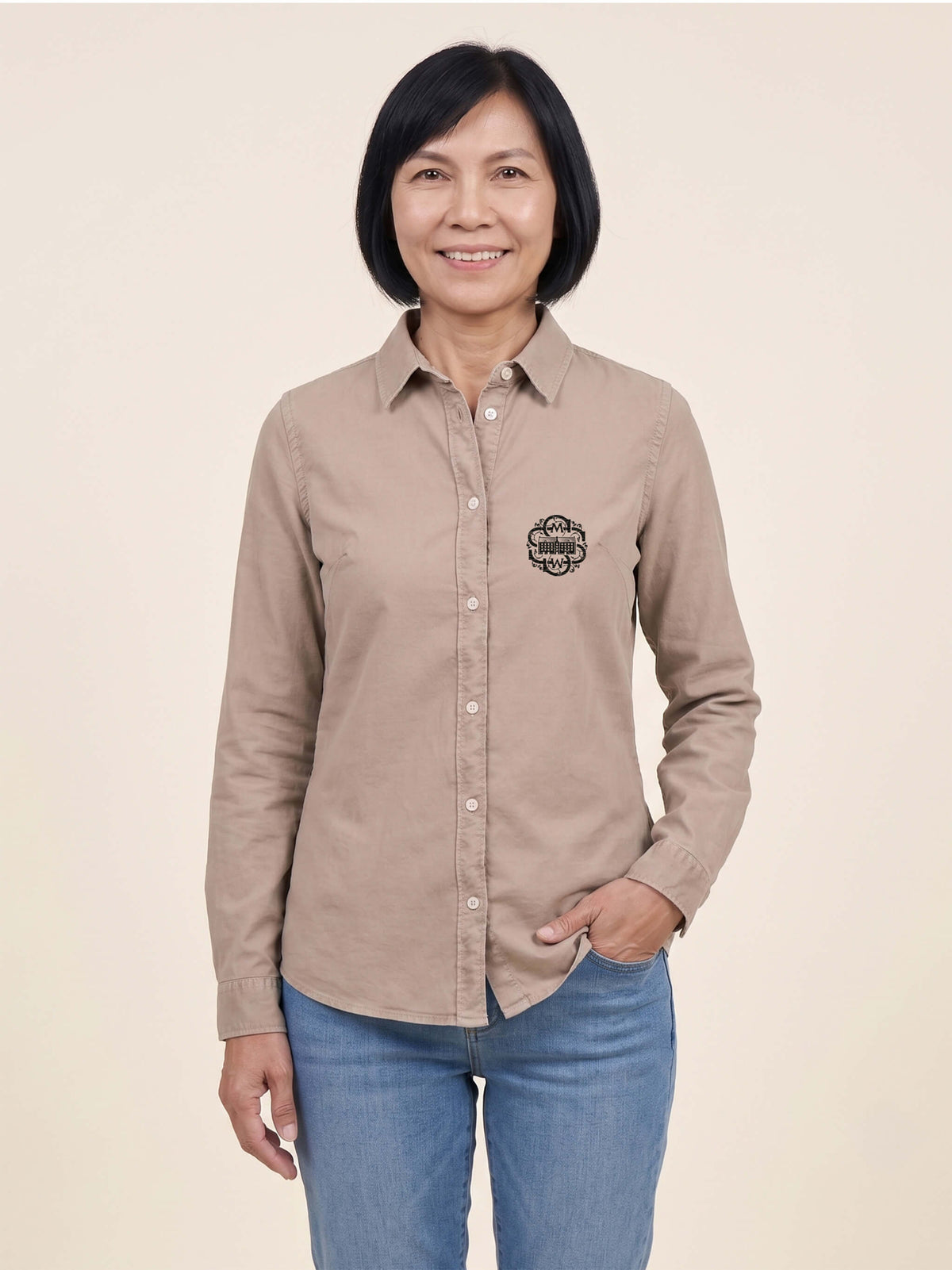 Woman wearing a washed linen Scottish Malt Whisky Society organic shirt with logo on the left chest. Can be personalised with your name on the right chest.