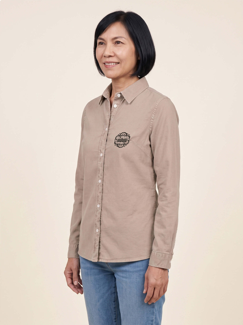 Side view of woman wearing a washed linen Scottish Malt Whisky Society organic shirt with logo on the left chest. Can be personalised with your name on the right chest.
