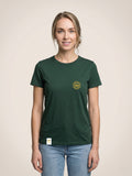 Woman wearing a forest green Scottish Malt Whisky Society t-shirt with gold logo on the left chest.